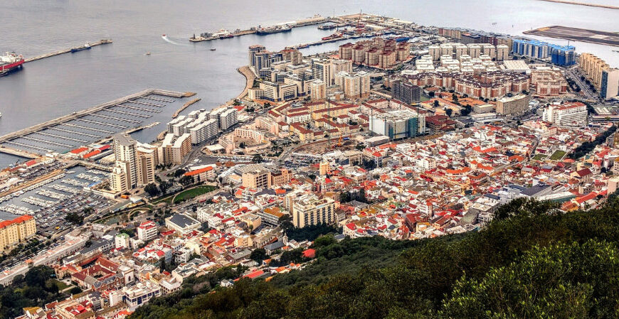 Aerial view of coastal city and harbor.